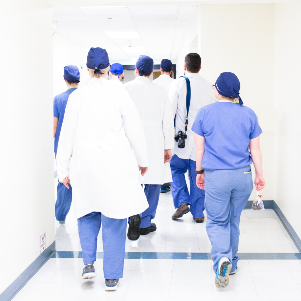 group of doctors walking down hall